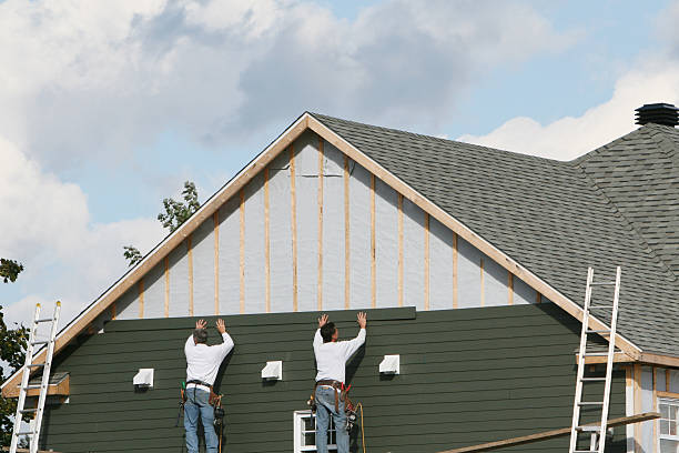 Professional Siding technician working in New Paris, PA